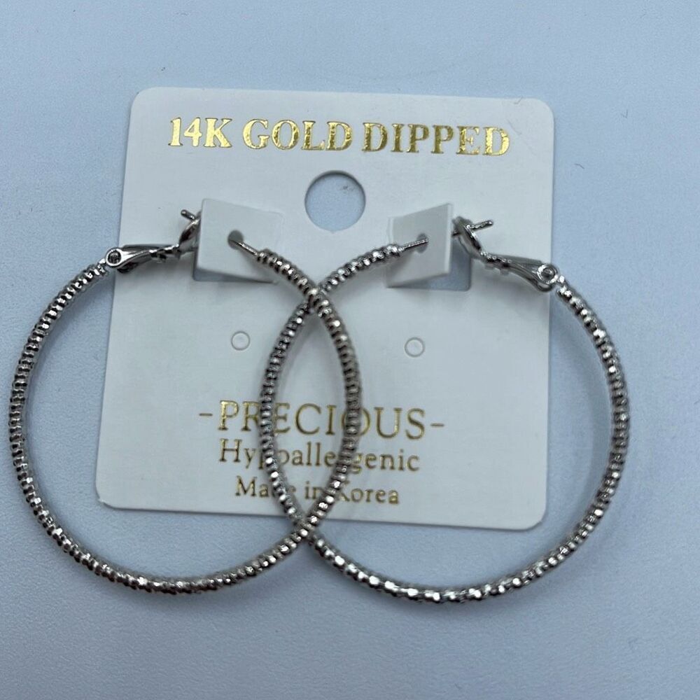 NWT Precious 14K white dipped gold textured hoops. Omega clasp.
